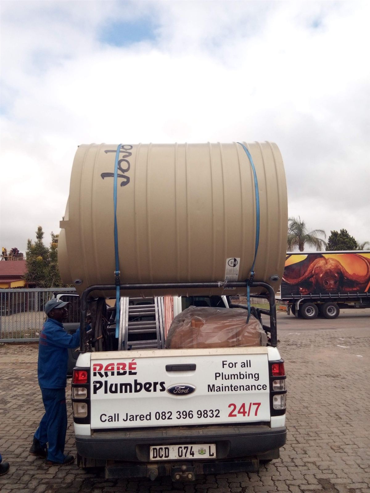 Rabé Plumbing bakkie loaded with a JoJo water tank, ready for an installation